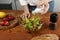 Close up of female hands salting salad