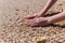 Close up of female hands on shellfish beach