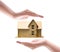 Close up of female hands sheltering modern house,Small wooden house covered by hands,Home protection and insurance concept