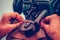 Close up of a female hands stitching leather parts on a sewing machine