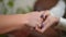 Close-up female hands and teen palms shaking covering each other. Closeup unrecognizable Caucasian psychologist and