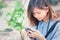 Close-up of female hands using modern smart phone while working,Young woman using a touchscreen smartphone