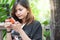 Close-up of female hands using modern smart phone while working,Young woman using a touchscreen smartphone