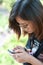 Close-up of female hands using modern smart phone while working,Young woman using a touchscreen smartphone with copy space