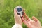 Close-up female hands, woman makes a test with a glucometer in nature, medical concept, blood glucose control, diabetes