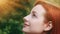 Close-up female inspired pretty profile face attractive model teenage beautiful redhead girl stands outside sunbeams