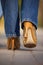 Close-up of female in jaguar spotted shoes walking