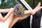 Close up of female legs with bouquet of wildflowers in car