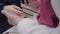 Close-up of female mature Caucasian hands holding hands of a young girl. Unity of grandmother and granddaughter.