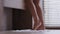 Close-up of female naked legs young unrecognizable woman doing morning leg exercise energetic girl dancing to rhythmic