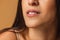 Close up female neck, collarbones isolated on pink studio background. Beautiful caucasian woman with well-kept skin.