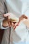 Close up of female pastry chef\'s hand cooking delicious macaroon