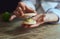 Close up of female pastry chef\'s hand cooking delicious macaroon