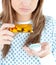 Close-up of a female patient taking pills