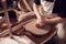 Close Up Of Female Potter Shaping Clay For Pot On Pottery Wheel In Ceramics Studio