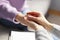 Close up of a female psychologist holding woman& x27;s hands during a therapy session.