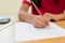 Close Up Of Female Pupil Taking Multiple Choice Examination Paper