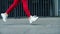 Close up female runner legs jogging on street. Closeup sporty woman training run