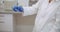 Close up of female scientist shaking test tube in laboratory