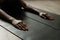 Close up of female yogi stretching during yoga flow practising positions in modern lounge