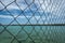 A Close up of fence with blurry turquoise water on the background taken at Harapan Island