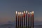 Close-up of festive burning wax candles that are traditional symbols of Hanukkah Holiday of Light