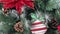 Close-up of a festively decorated Christmas tree with balls on a blurred sparkling fairy background. Defocused garland