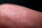 Close-up of fingerprint texture of finger skin macro photography