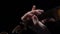 Close up fingers of a musician sifting the violin . Black background