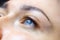 Close-up of the finished work of permanent makeup of eyelashes and eyelid