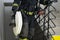 Close-up of a firefighter holding water handling equipment, barrel and sleeves