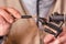 Close up of fisherman tying a fly for fishing.