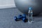 close up of fit ball, dumbbells and bottle of water