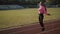 Close up of fitness-woman feet jumping, using skipping rope in stadium