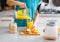 Close-up on fitness woman pouring pumpkin smoothie