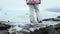 Close up Fjallsjokull glacier lagoon with person stands on iceberg. Wonderful glacier lagoon of FjallsÃ¡rlÃ³n in Iceland melts