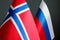 Close up of the flags of Norway and Russia.