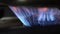 Close-up of the flame of a kitchen burner. Burning gas flame on the stove.