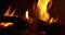 Close up flames in a fireplace with wood coal