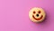 Close up flat lay of yellow smiley happy face donut isolated on