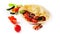 Close up of flatbread pita with vegetables, cucumber, tomato, red pepper and mushrooms at white isolated background. Fried ohnny