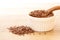 Close up flax seed in wooden spoon , super food with hight of a fiber nutrient and anti inflammatory omega-3 fatty acids