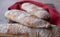 Close up of floury home made ciabatta sour dough loaves cooling on a wire tray, baked during the Coronavirus lockdown.