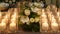 Close up of flower decor and candles on the dinner table