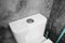 Close up on a flush toilet button for cleaning a toilet.