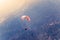 Close up of a Flying colorful parachute paragliding on beautiful mountain background. Solang Nullah, Kullu District, Manali Tehsil