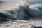 close-up of foaming waves pounding the shore during a tsunami