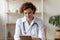 Close up focused confident woman doctor using digital tablet