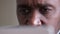 Close-up focused male eyes gaze unrecognizable African American mature man businessman elderly face with wrinkles