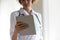 Close up focused woman professional doctor holding digital tablet